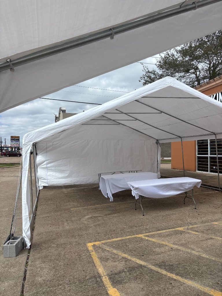 White canopy with draped tables — versatile outdoor elegance 🎪