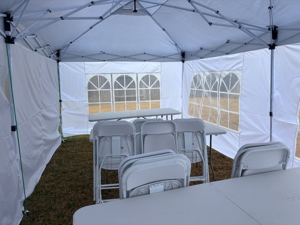 Tent interior with tables & chairs — immaculate & ready 🪑