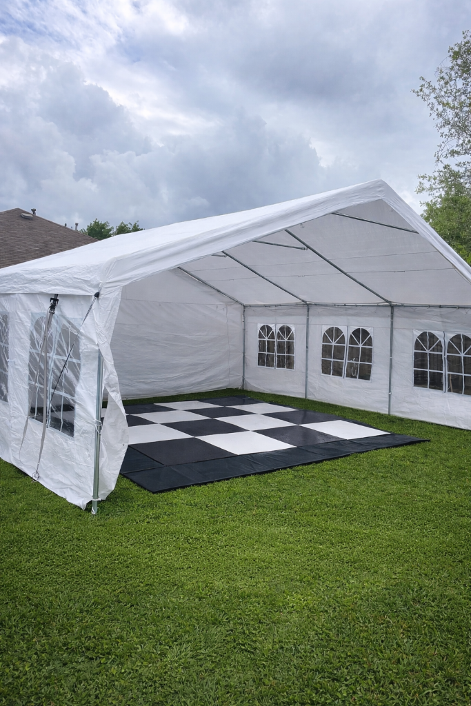 Tent with iconic black & white checkered dance floor 🎉