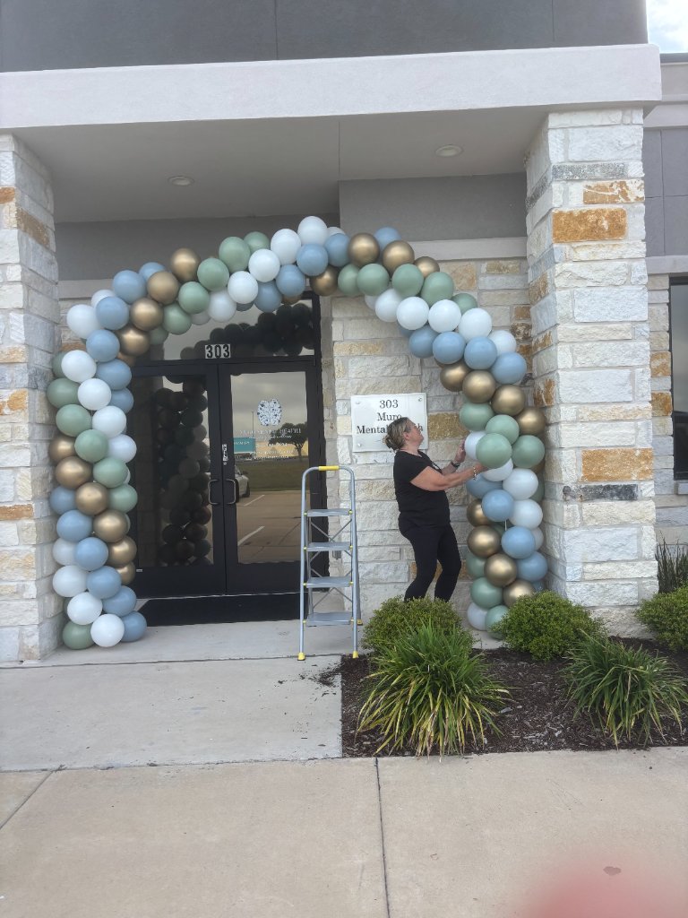 Sage, blue & gold arch — commercial grand opening 🏢