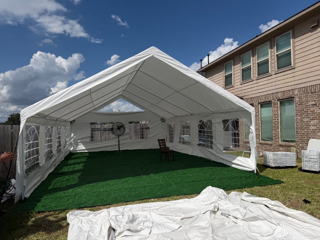 White frame tent on green turf — elegant outdoor venue 🌿