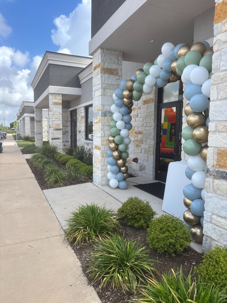 Sage & gold columns — luxury business entrance ✨