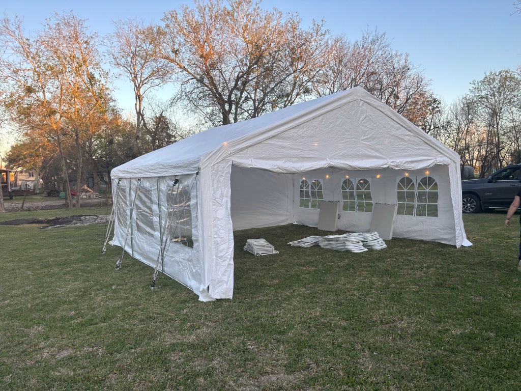 Expansive white frame tent with arched windows ⛺