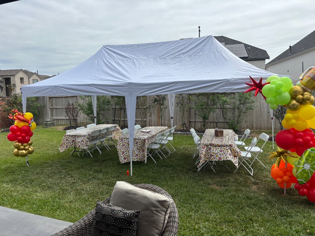 Fiesta backyard — white canopy, colorful linens & balloon columns 🎉