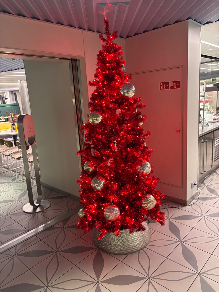 Red Christmas tree with mirror ball ornaments — festive glam 🎄