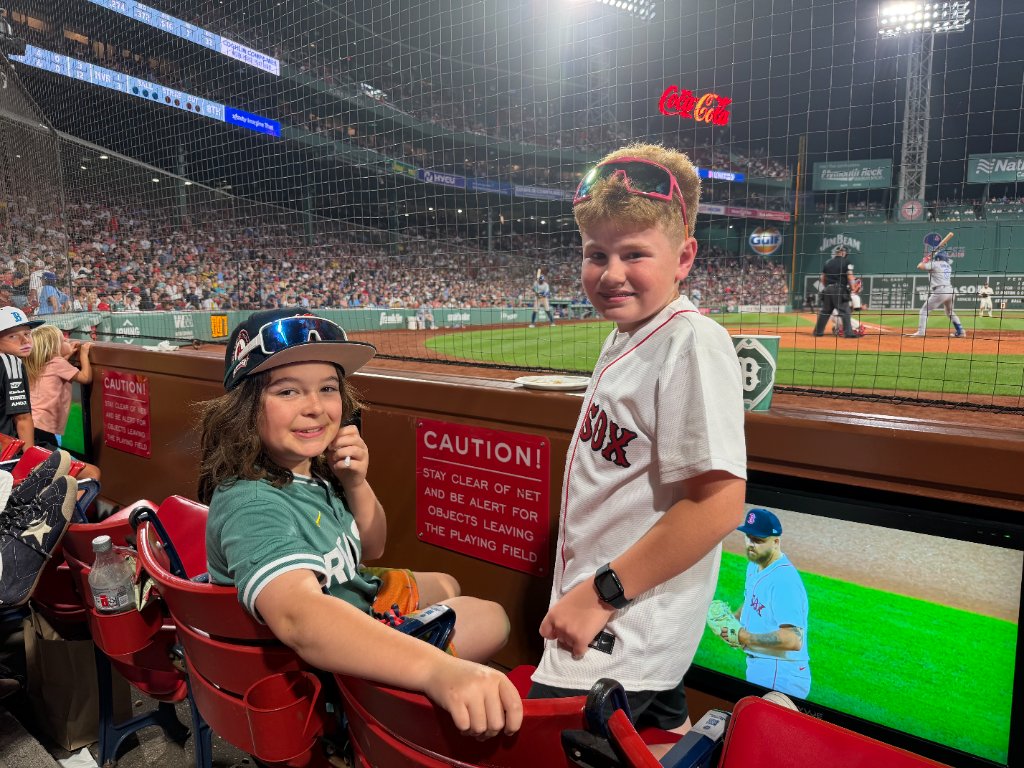 Gabe and friend in the stands at Fenway Park night game