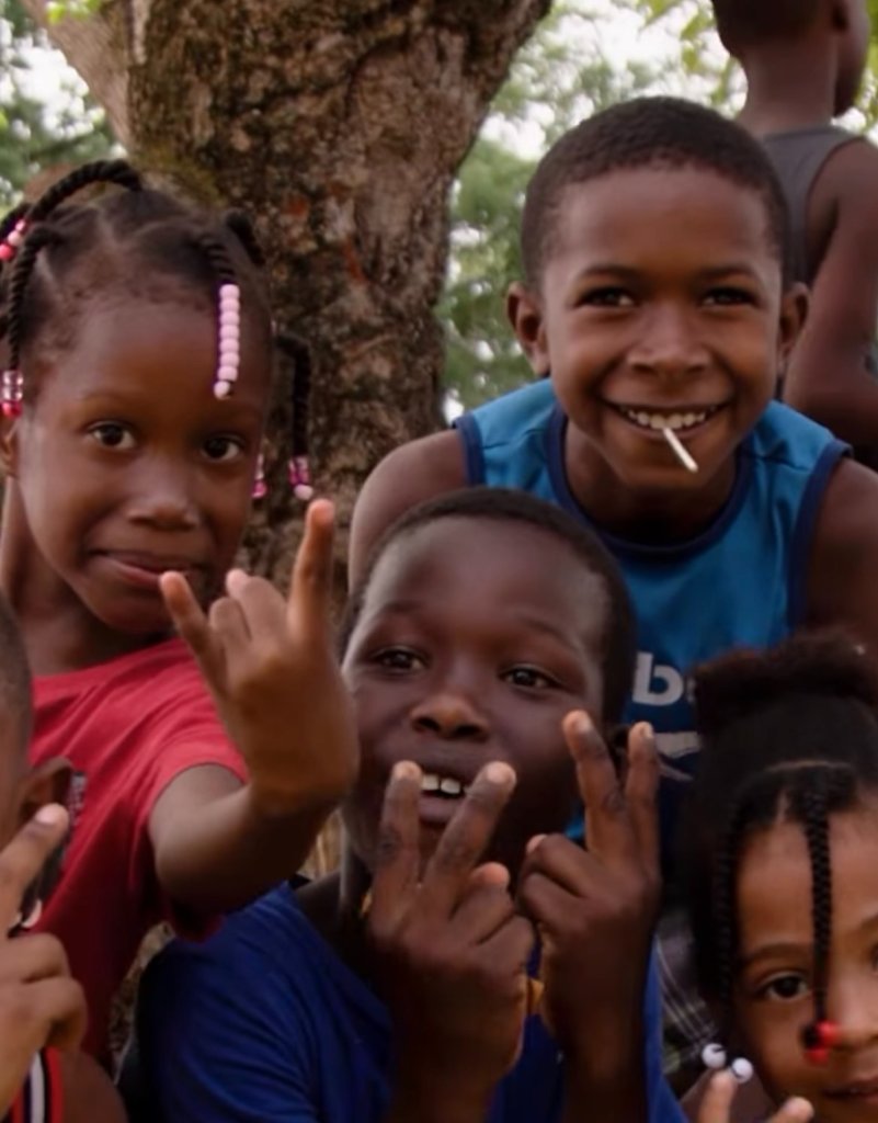 Local children smiling for the camera