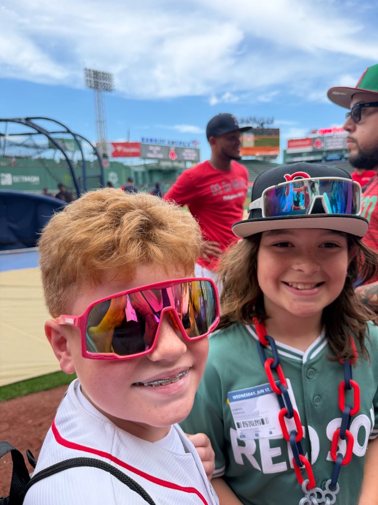 Gabe and friend posing at Fenway Park