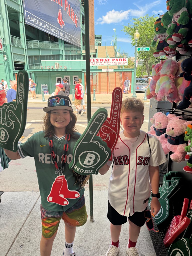 Gabe with foam fingers outside Fenway Park
