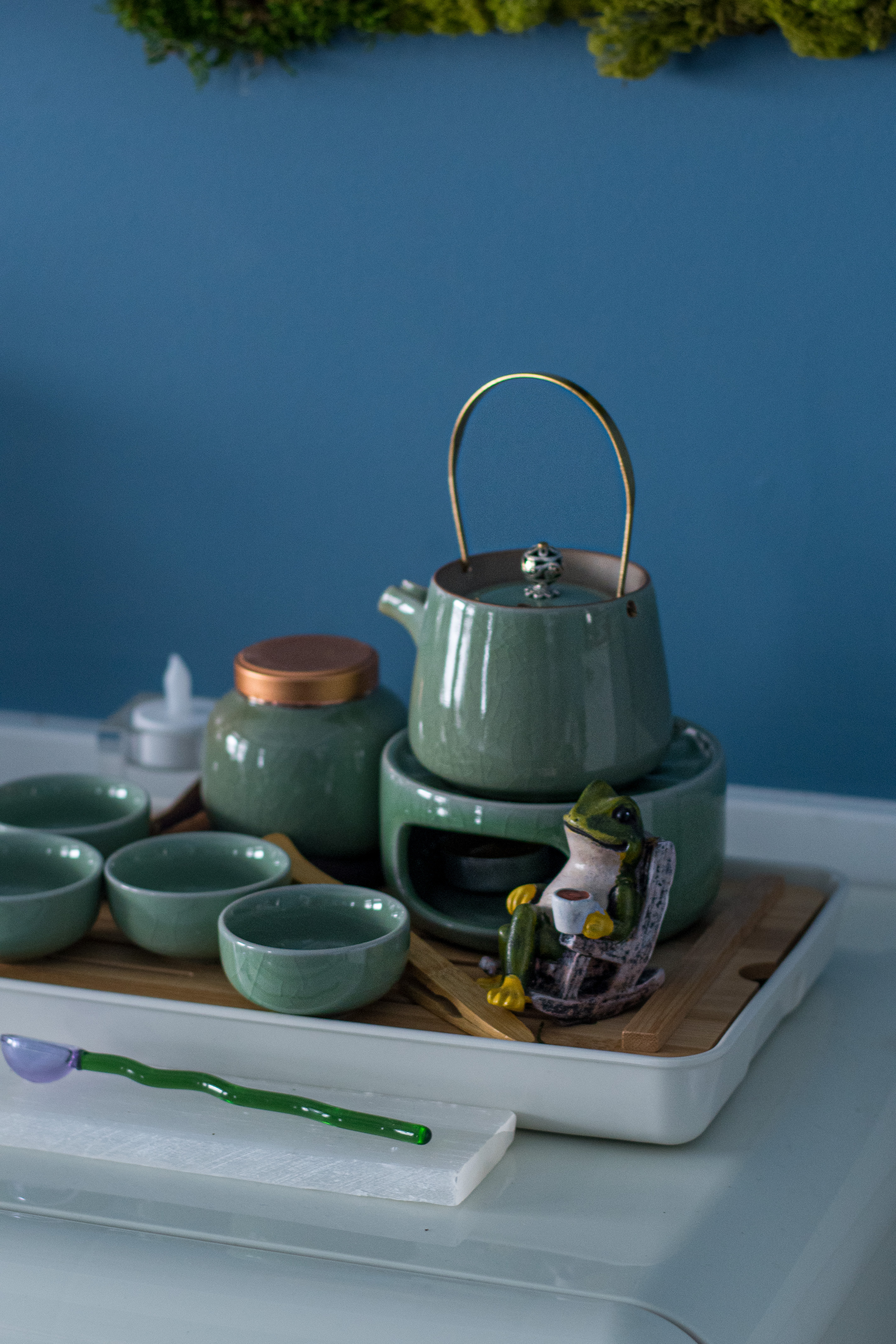 The Practice — a celadon tea set with teapot, cups, and a frog figurine on a bamboo tray