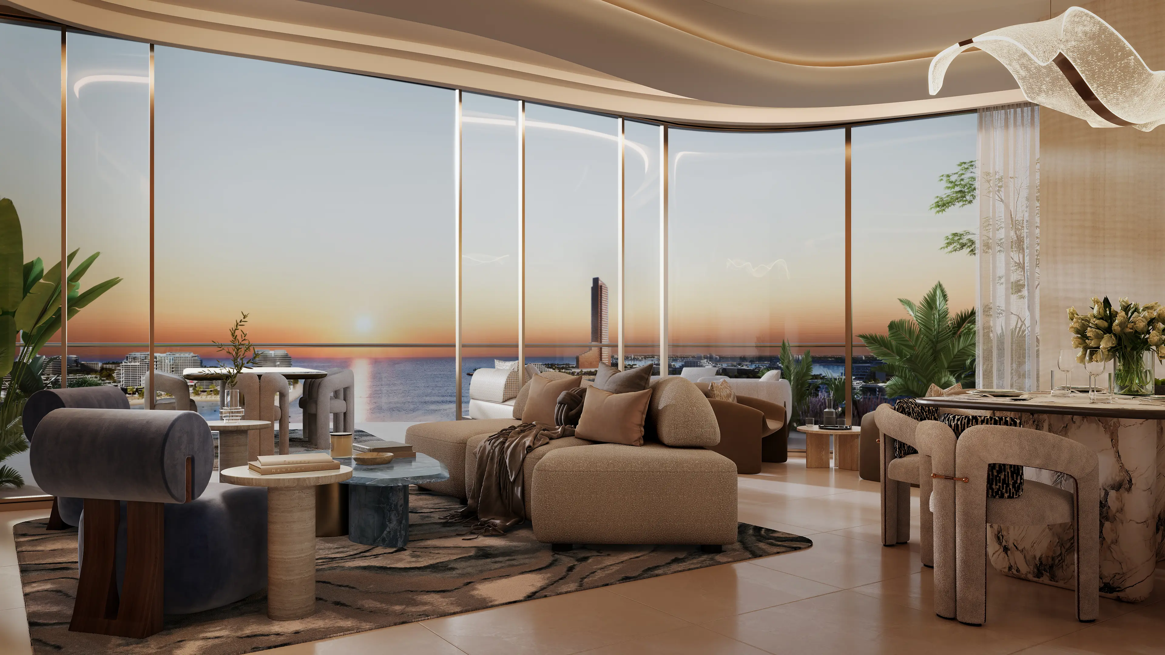 Intérieur d'appartement 2 chambres Oystra by Richmind au coucher du soleil : salon et salle à manger ouverts avec vue mer, canapé modulaire et luminaire sculptural.