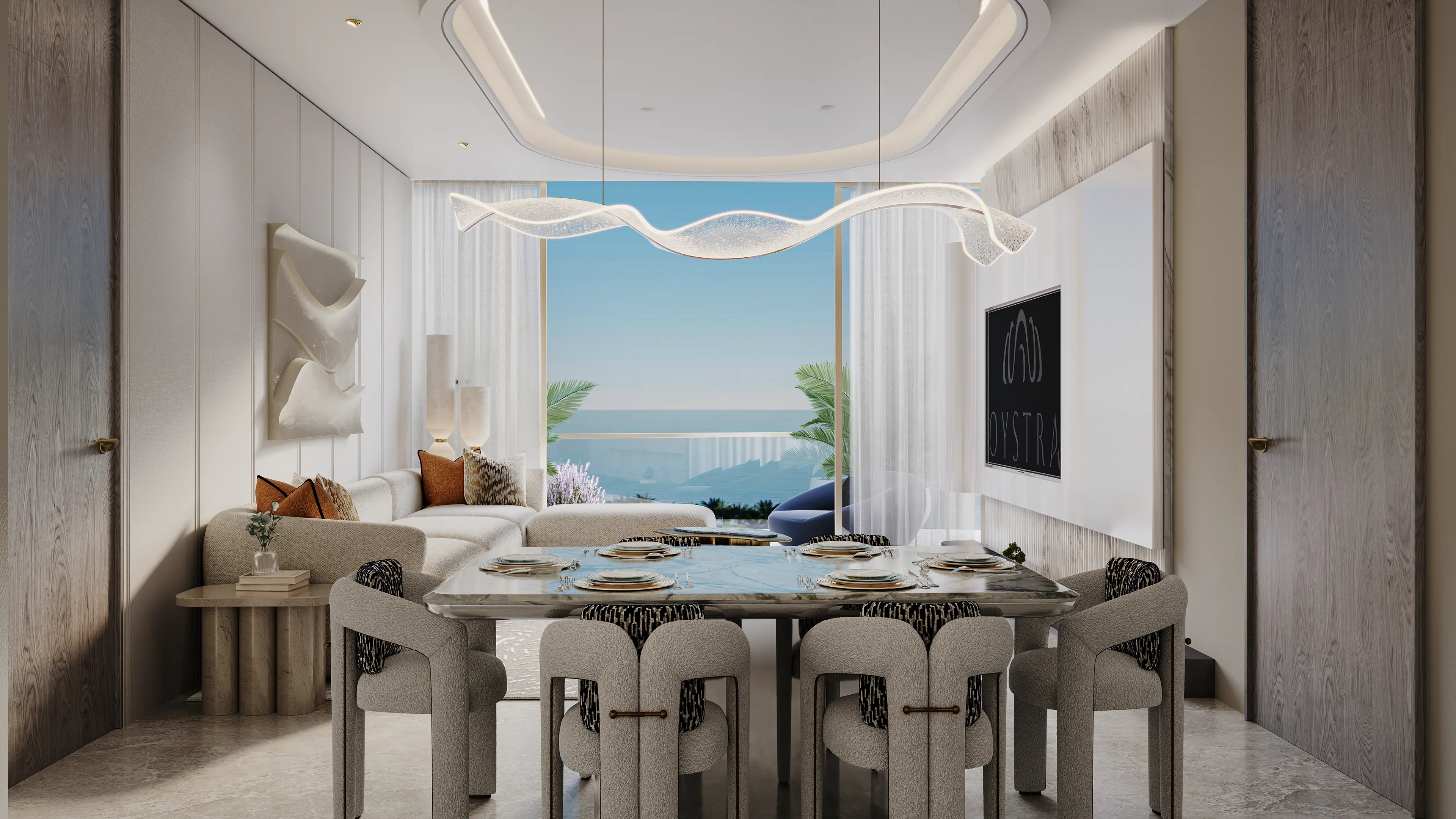 Intérieur d'appartement 2 chambres Oystra by Richmind : cuisine ouverte, salle à manger en marbre et salon avec vue mer panoramique et écran OYSTRA.
