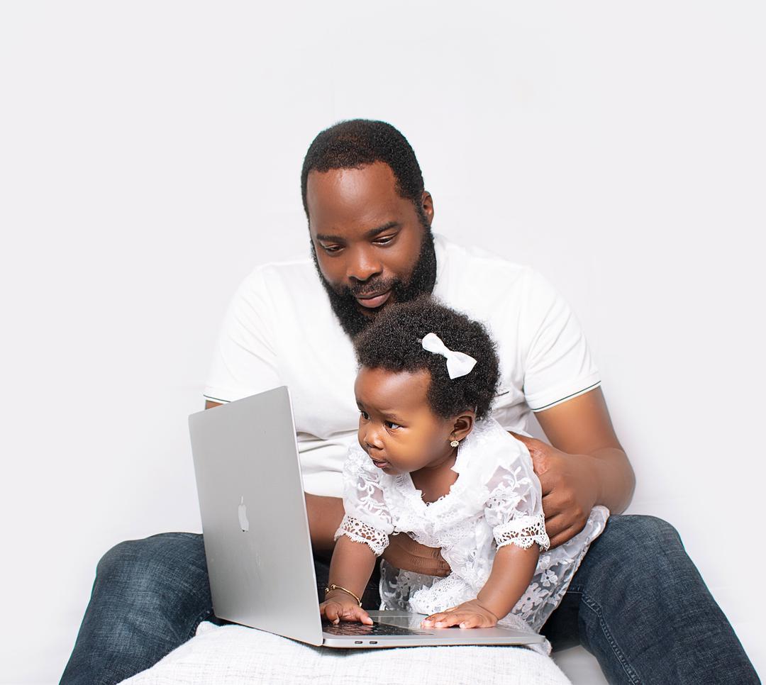 Father and daughter with laptop