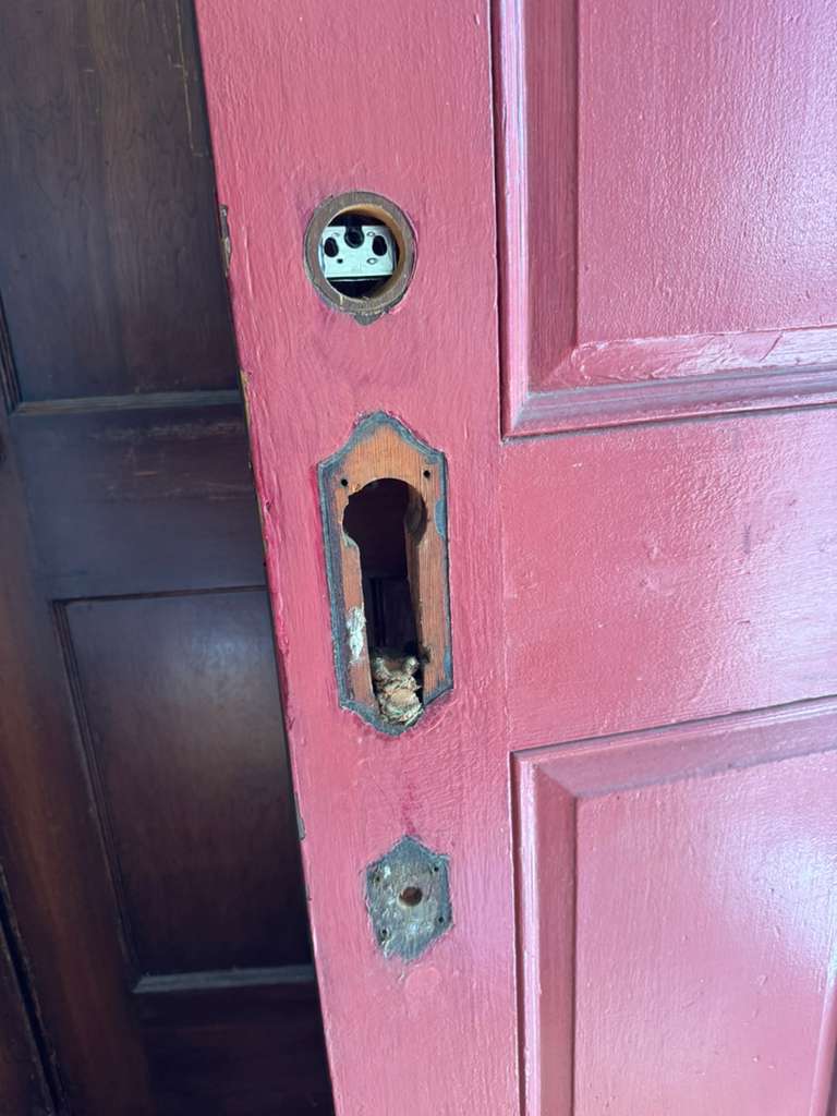 Door prepared with mortise cutout for new lock installation