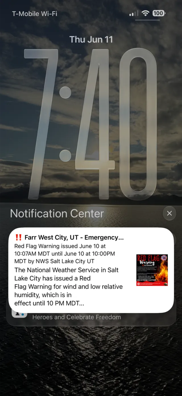 iPhone lock screen showing a Farr West City emergency alert
