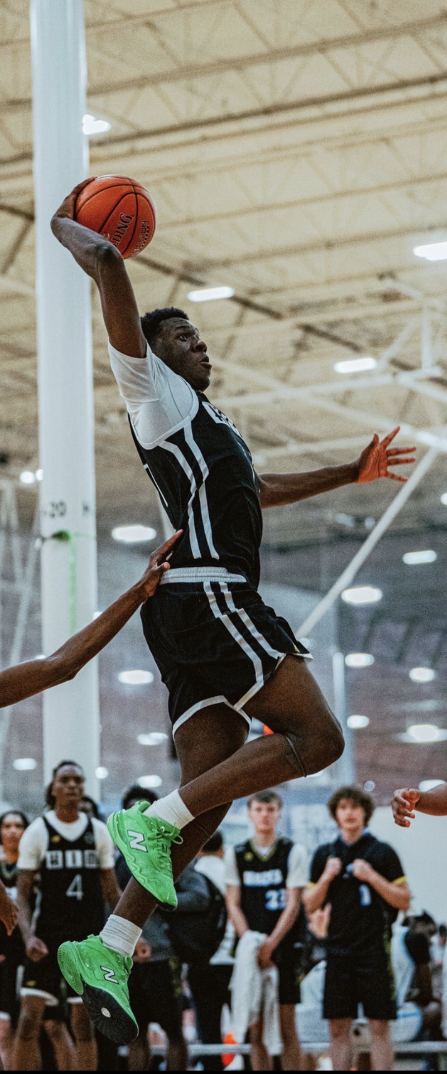 HIM League Basketball player mid-air jump - Youth basketball training Delaware Maryland Pennsylvania