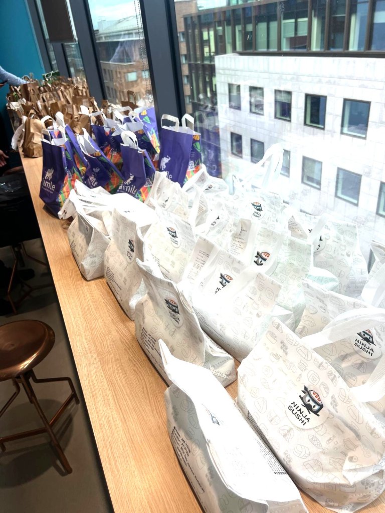 Restaurant delivery bags lined up for Dublin office team lunch
