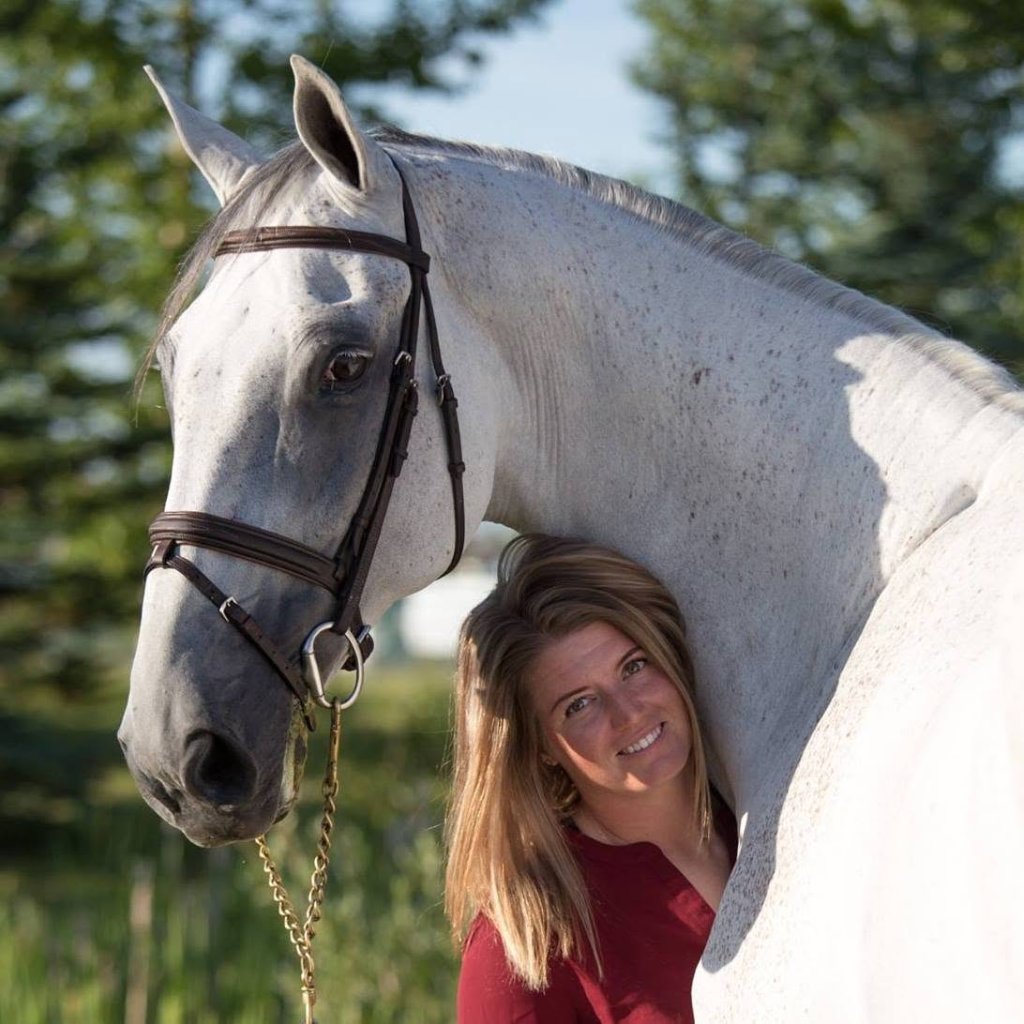 Jess, founder of Horse Hub, with her grey horse