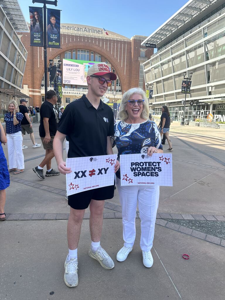 NHSC volunteers holding signs at a rally