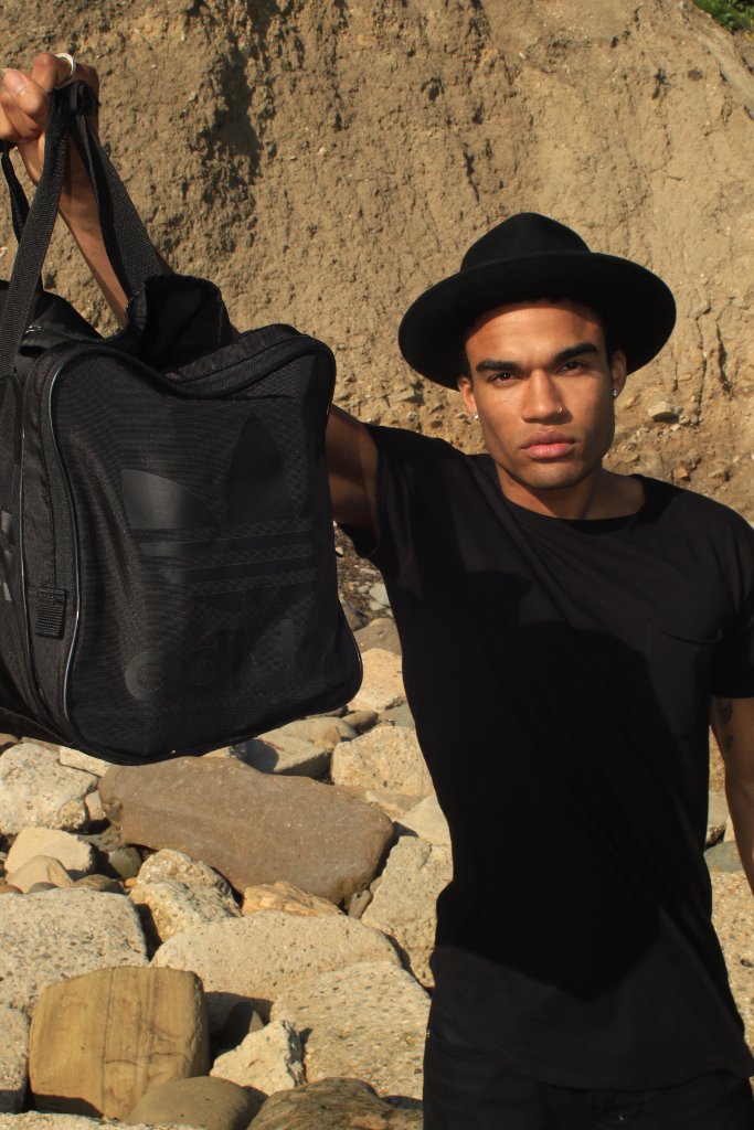 Man in Black with Adidas Bag