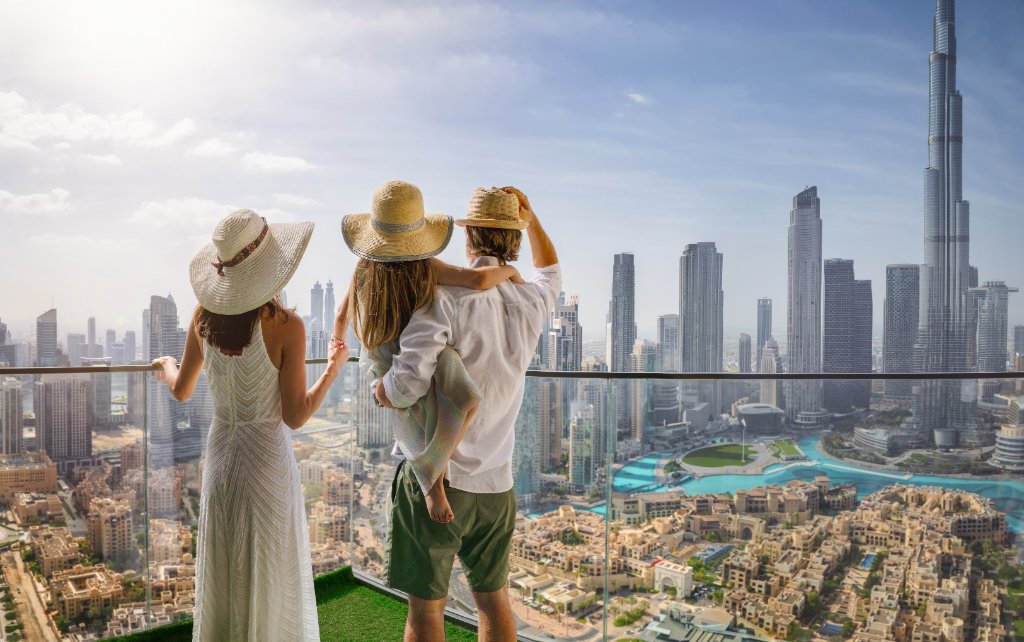 Family looking at Dubai skyline securing their future