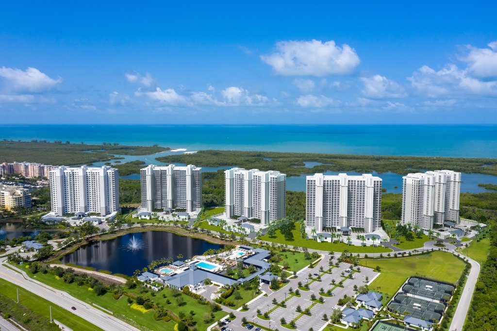 Aerial view of Kalea Bay five-tower luxury waterfront community in North Naples