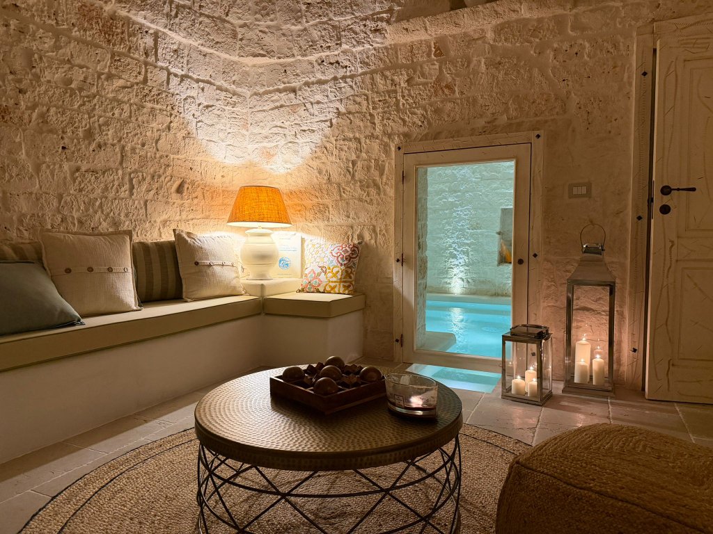 Cozy trulli living room with pool view