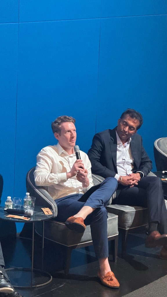 Speakers on stage — Tyler Reinmund & Preetham Hegde