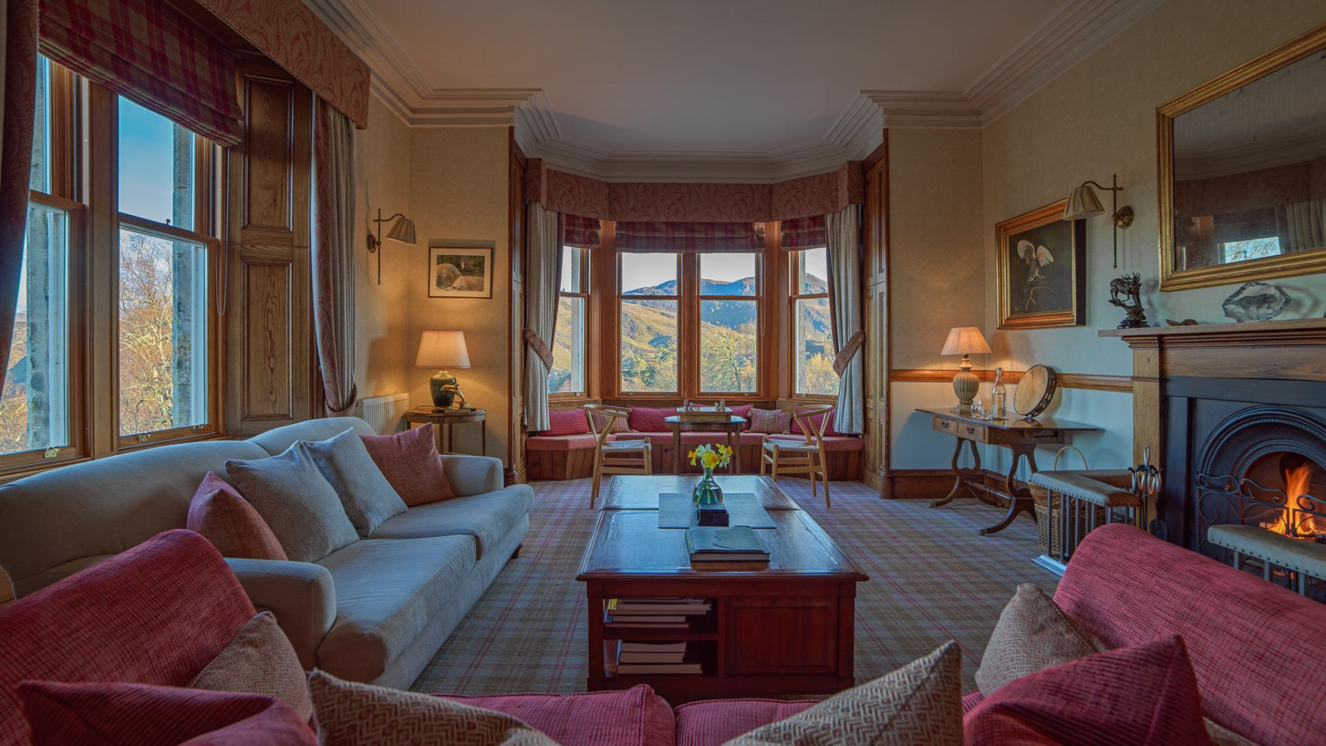 The lounge at Alladale Lodge with the fire lit