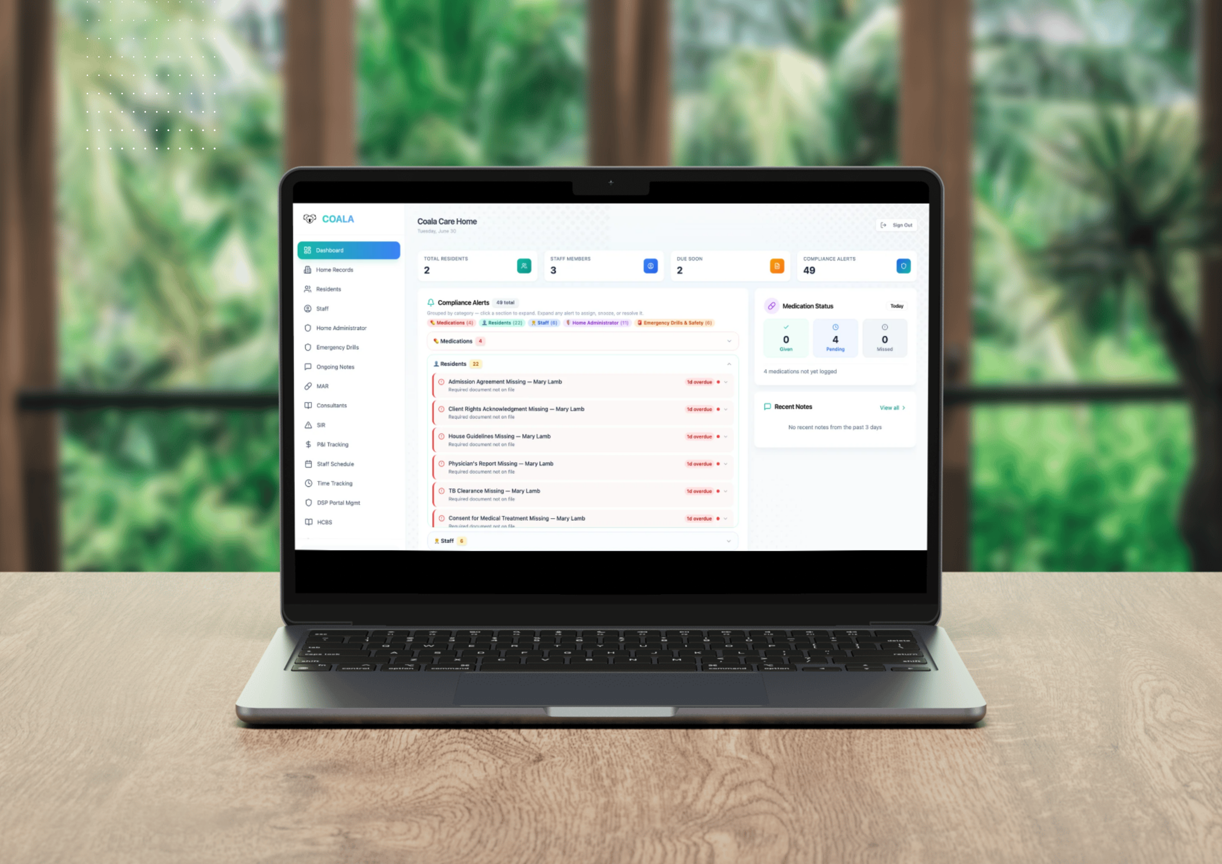 COALA care home platform dashboard on a laptop