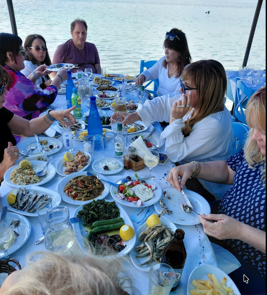 Group dining by the sea