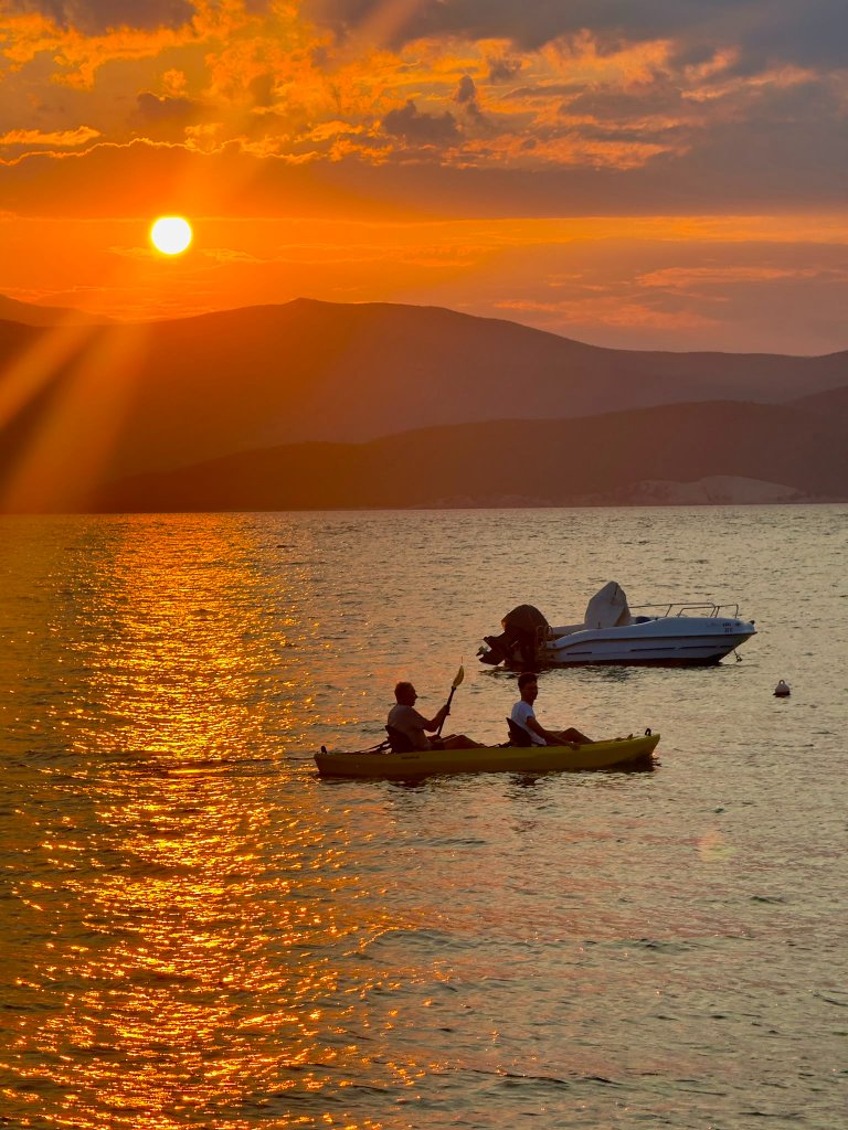 Sunset kayak on sea