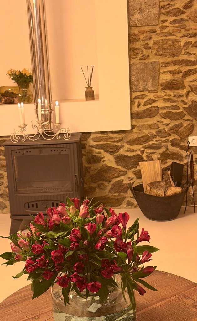 Flowers by fireplace