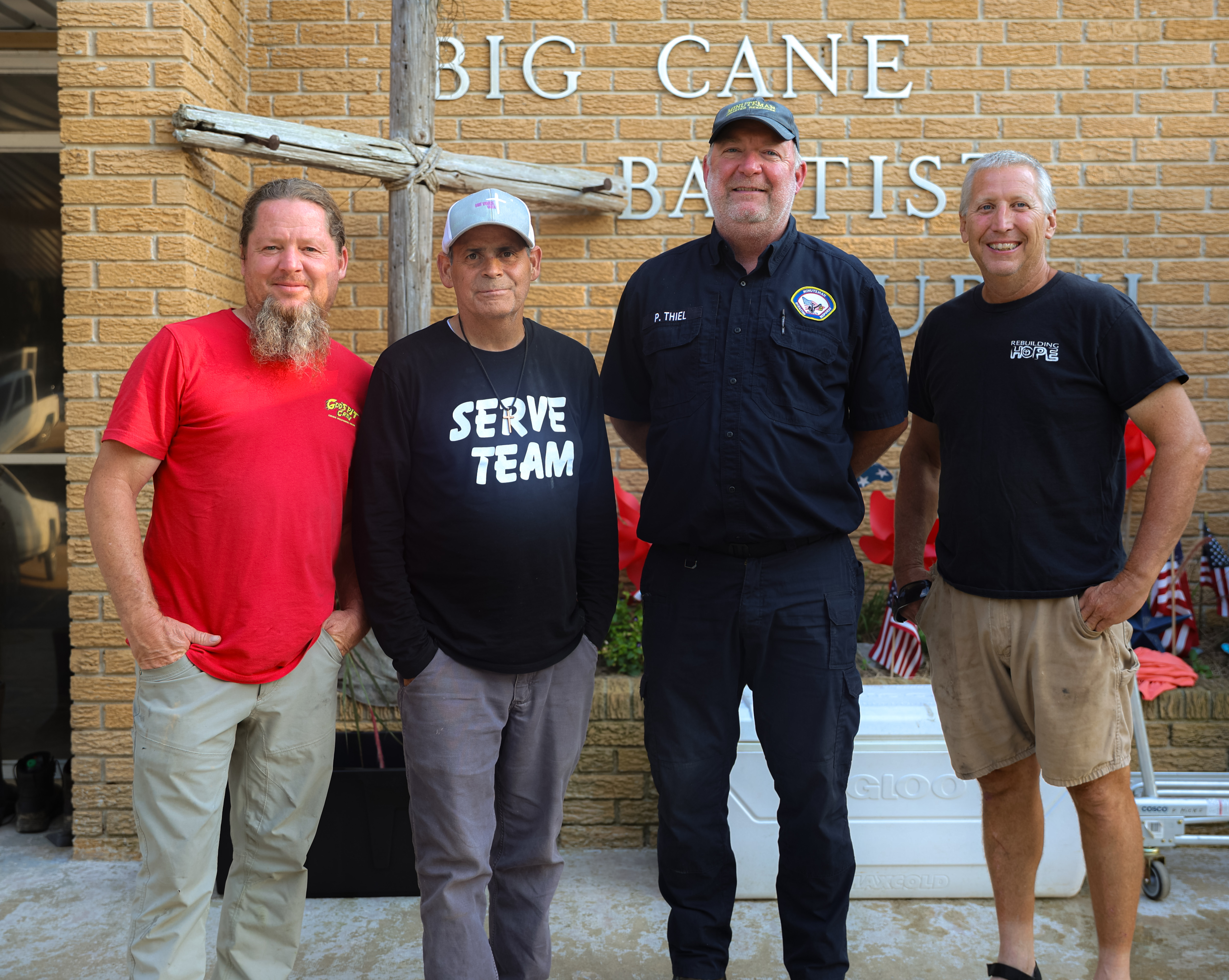 Disaster response partners standing together outside Big Cane Baptist Church