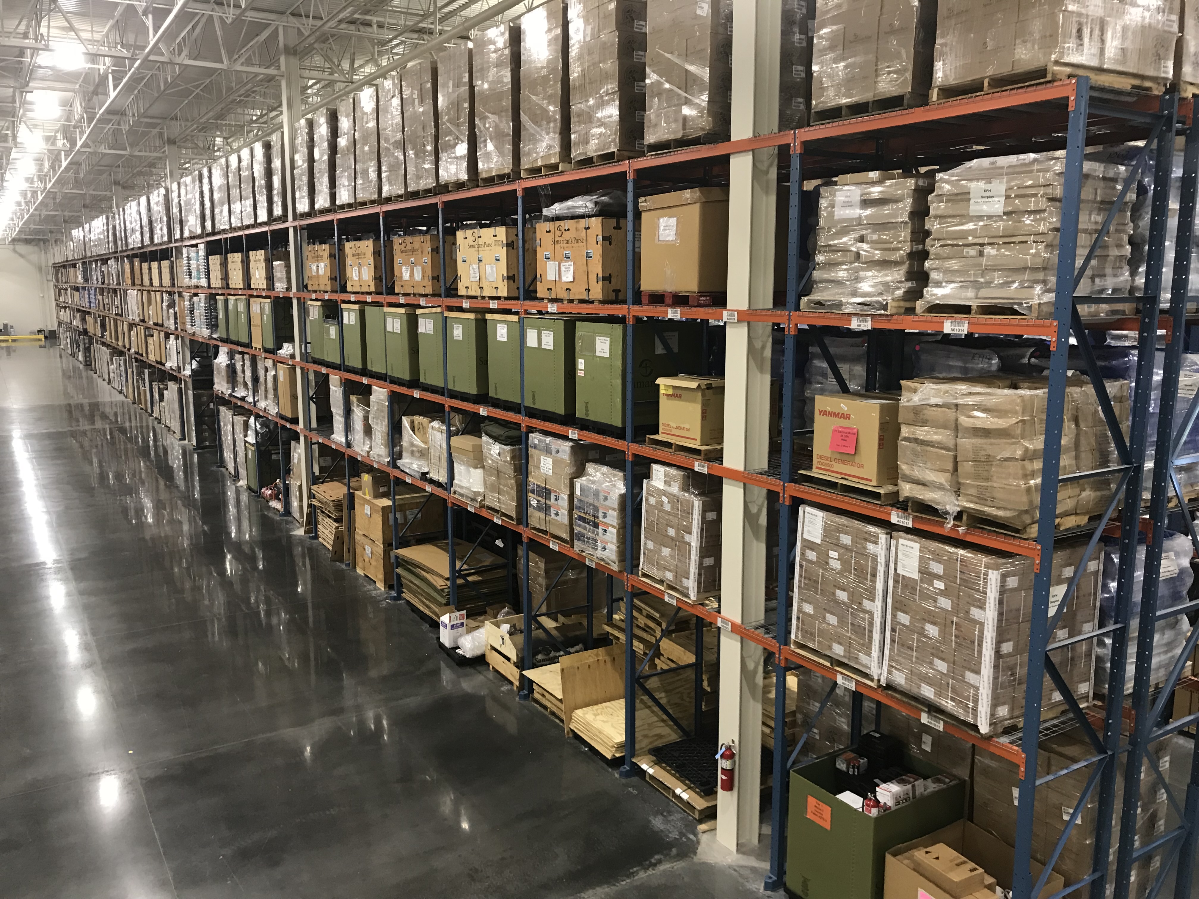 Partner warehouse shelves stocked with relief supplies