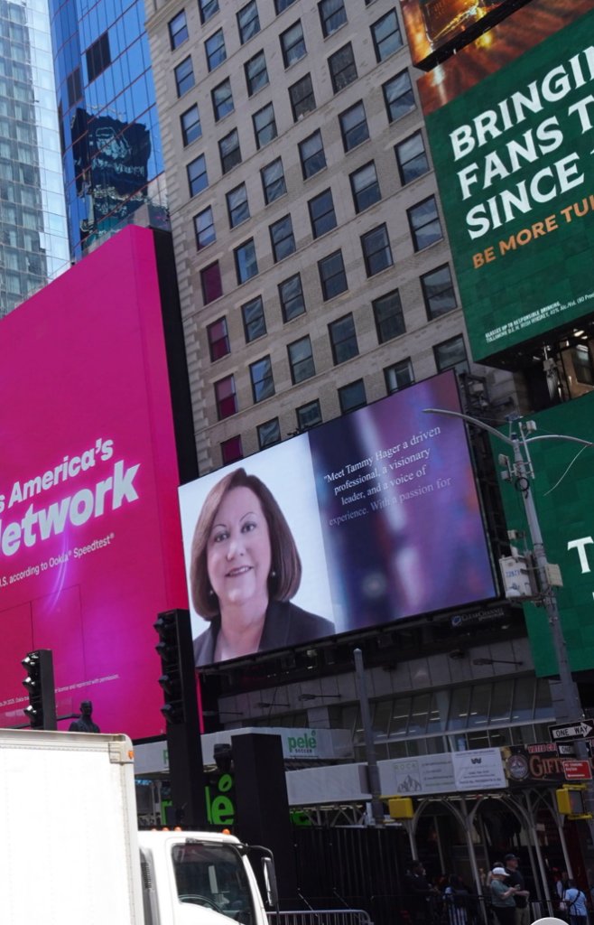 Tammy D. Hager's photo displayed on the Times Square digital screen — May 19, 2026