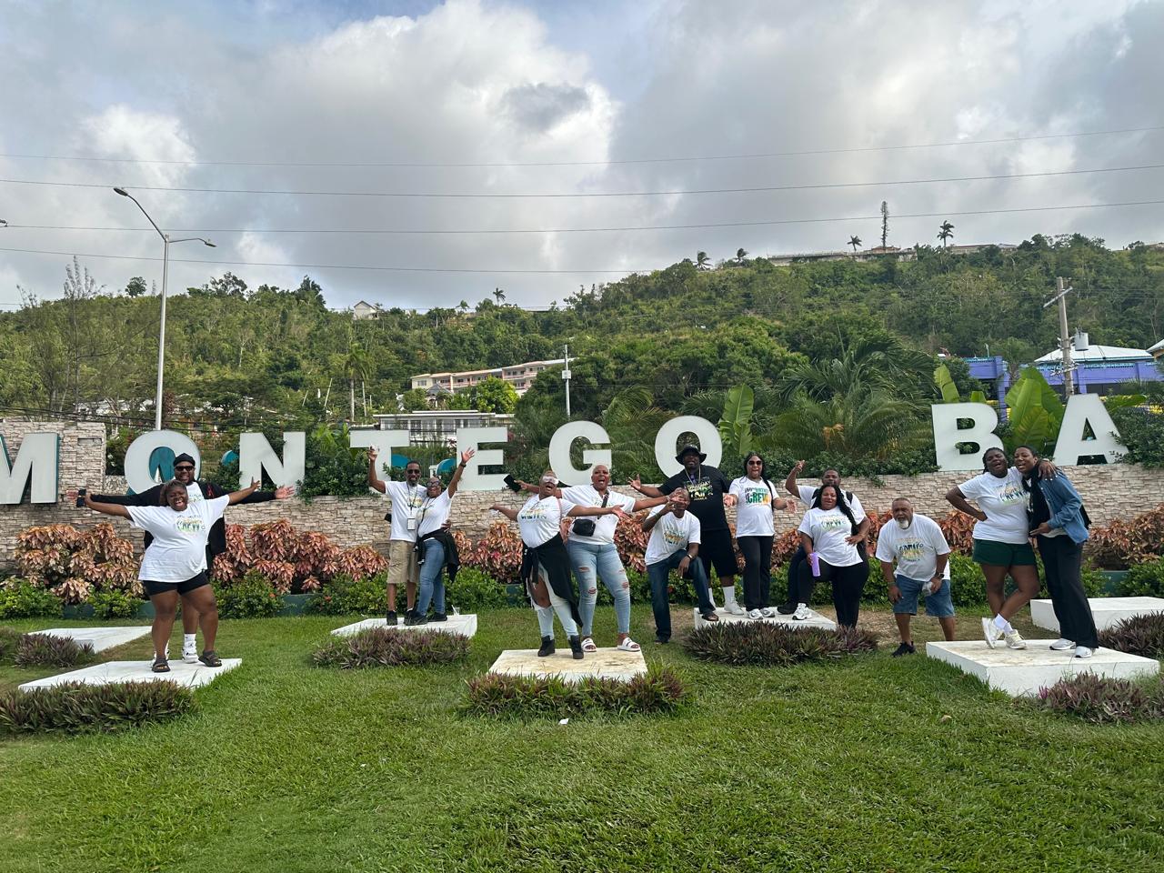 Group in front of the Montego Bay sign