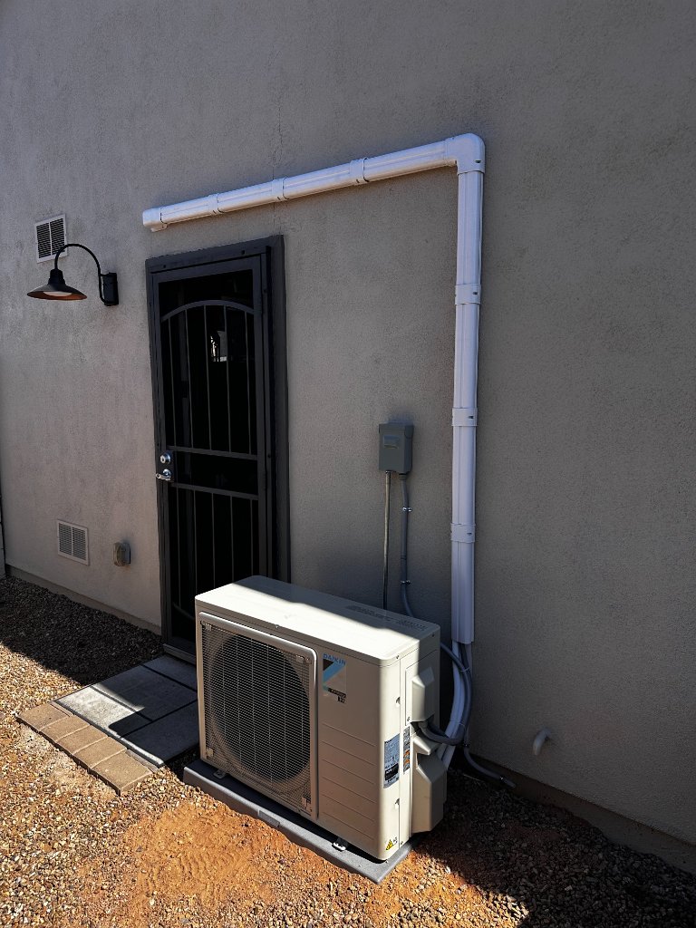 Core Comfort HVAC technician repairing a mini-split in Phoenix