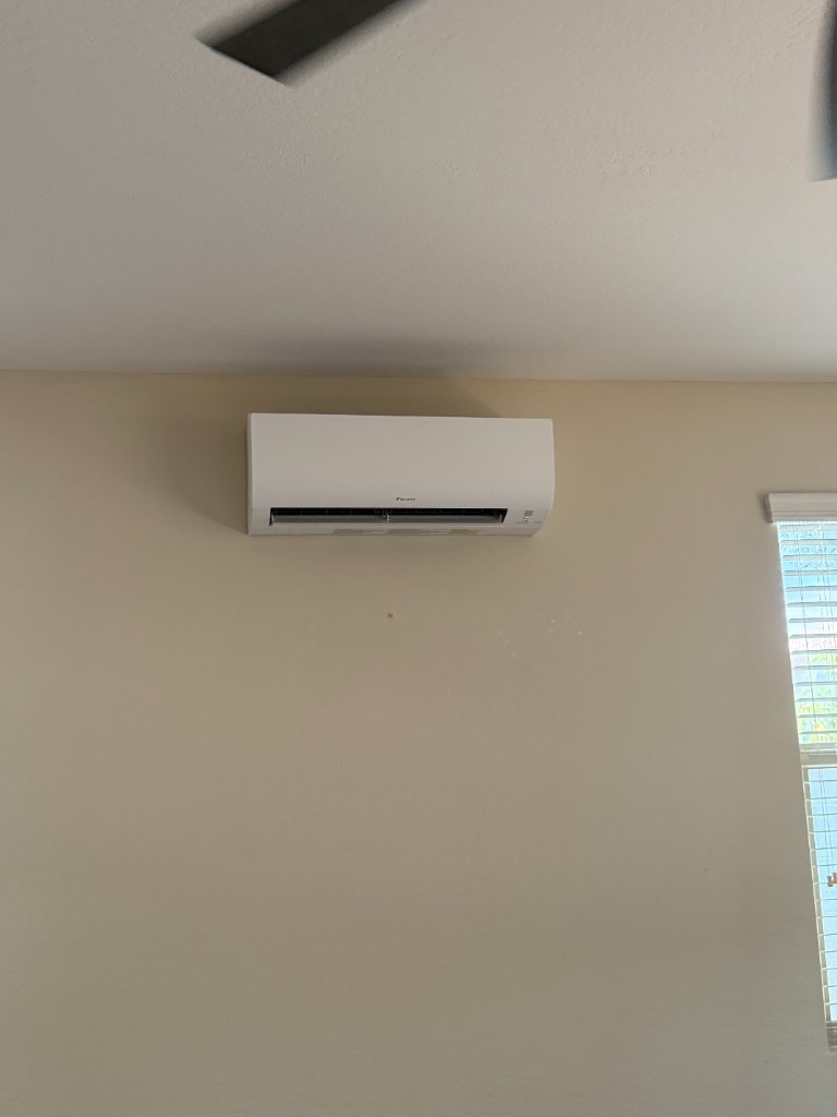 Professional mini split repair technician servicing outdoor condenser Phoenix Arizona