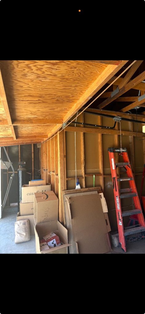 Modern dark wood grain garage door with frosted glass panels installed at contemporary Los Angeles home by MSB