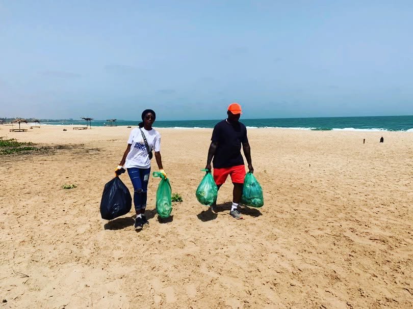 Collecting trash along the shore