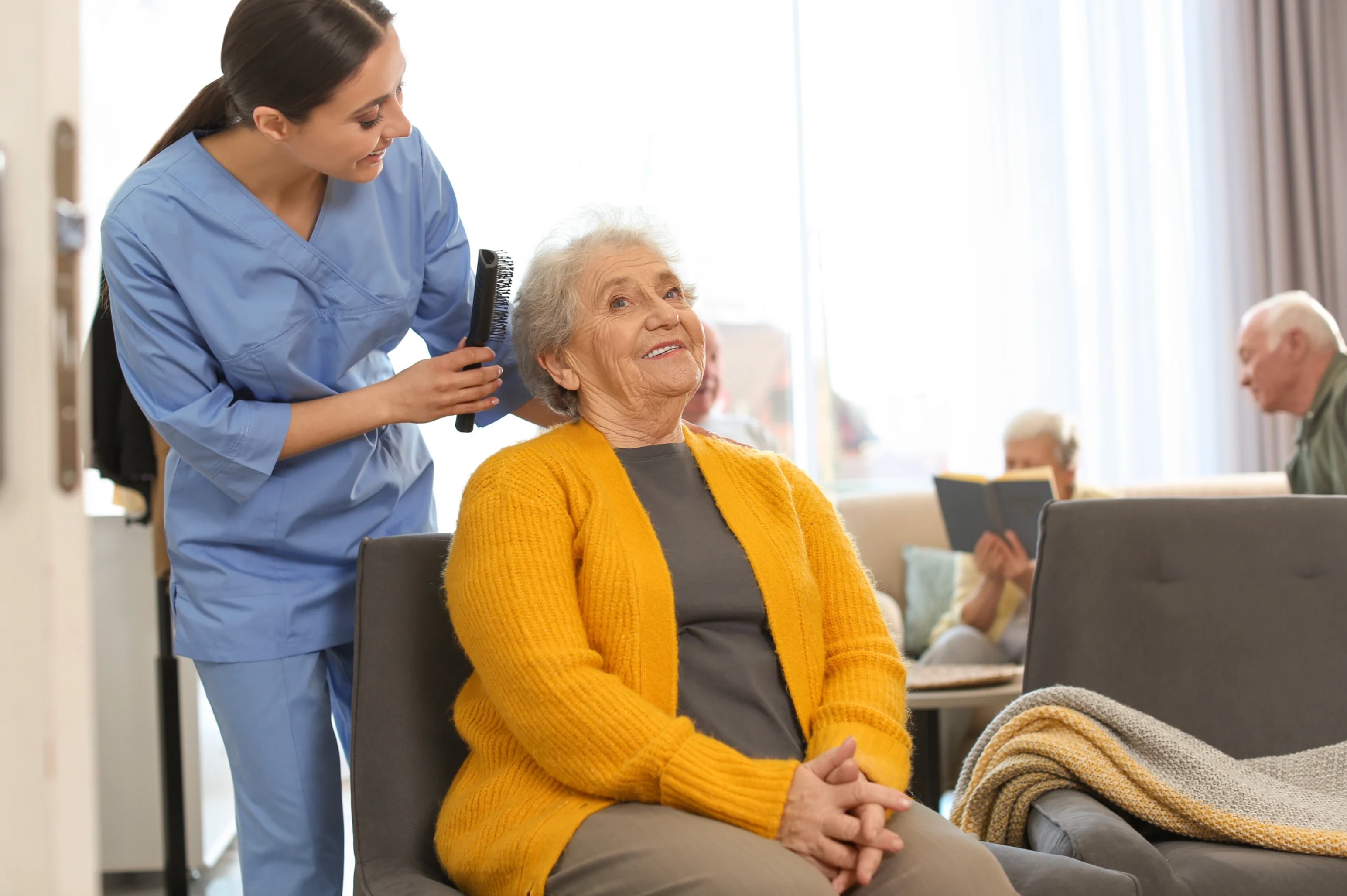 Caregiver providing personal care to senior