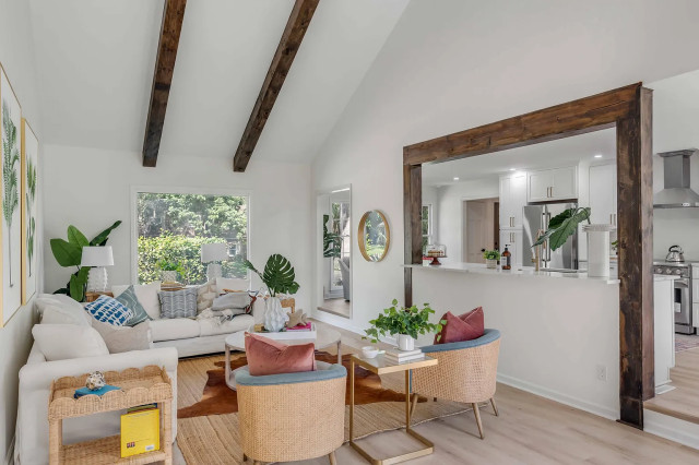 Open living area with white sectional and picture window view