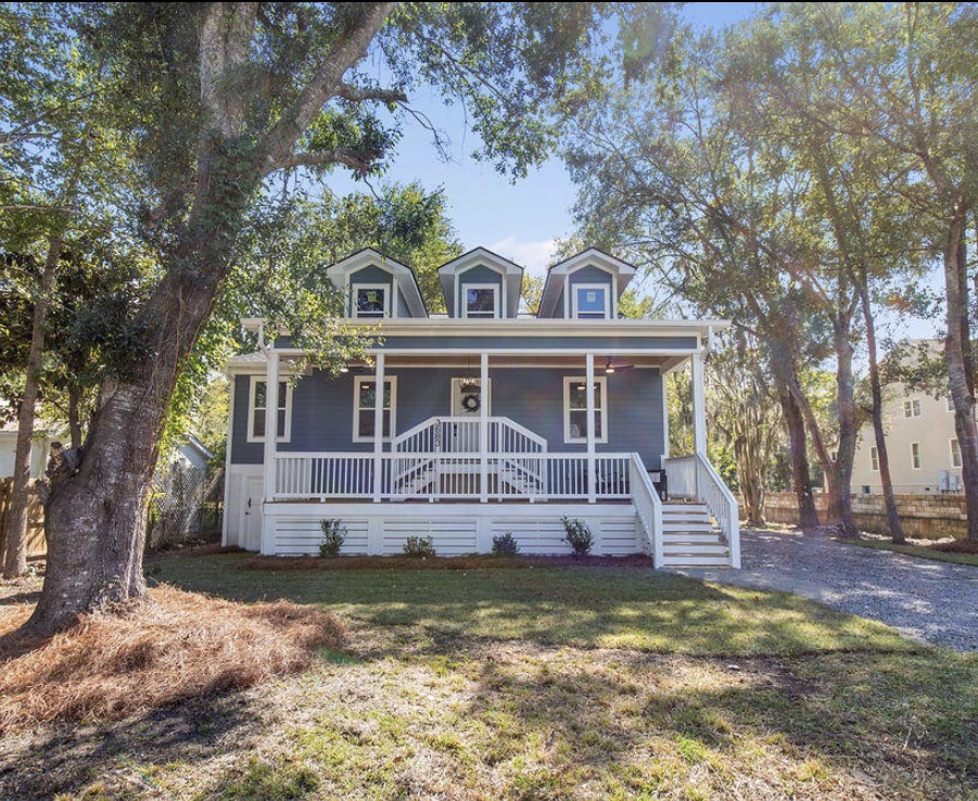 Exterior framed by oaks with Spanish moss