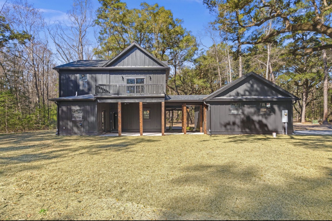 Rear exterior with second-story deck and covered porch