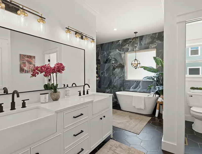 Primary bathroom with double vanity and soaking tub