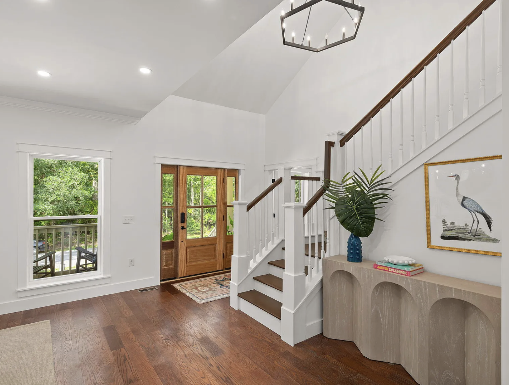 Foyer with double front doors and vaulted ceilings