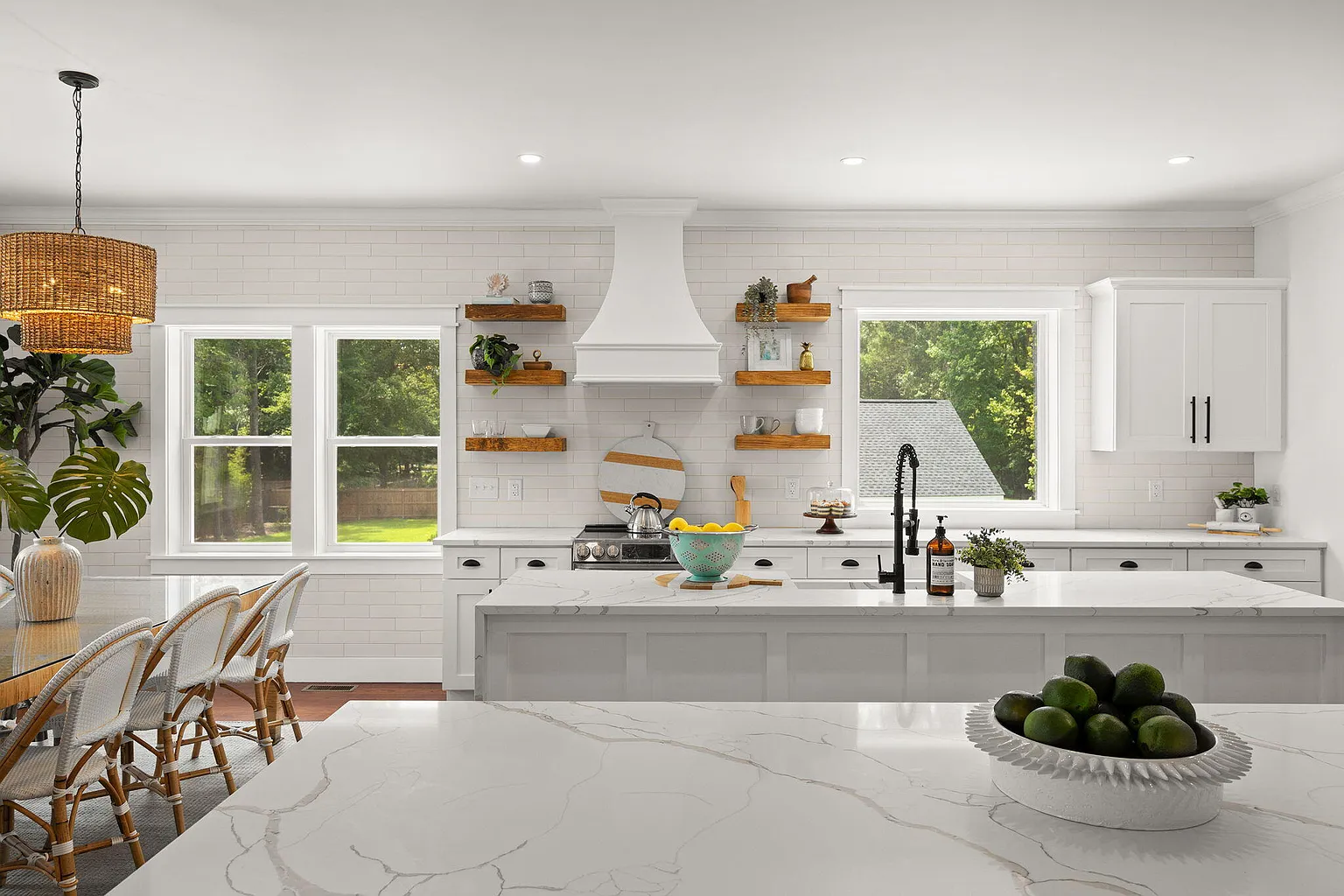 Kitchen island with farmhouse sink and subway-tile backsplash