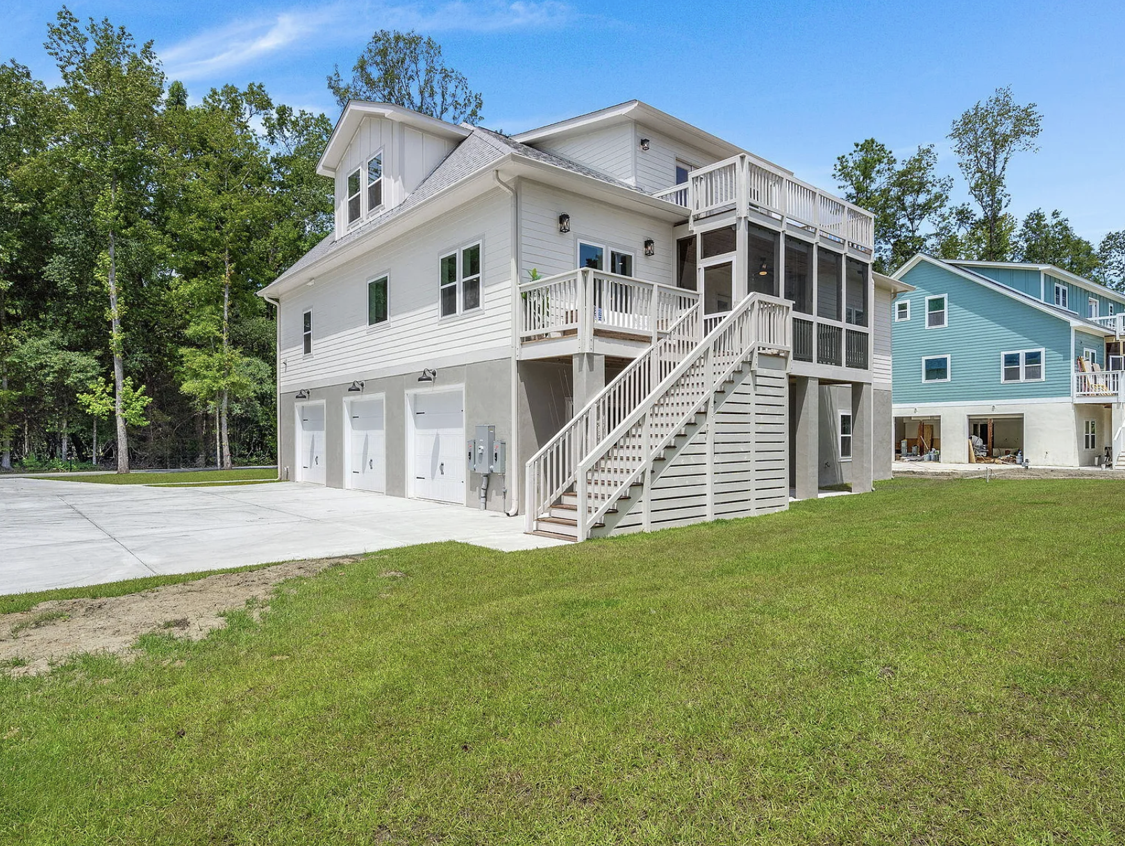 Side elevation with three-bay garage and exterior stairs