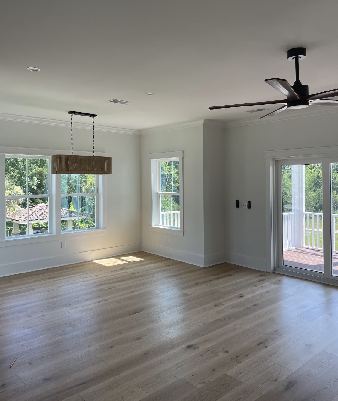 Light-filled living space with woven chandelier